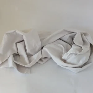A soft, white cotton body pillowcase suitable for use as a dog mobility sling.