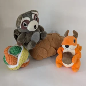 A collection of plush snuffle toys including a raccoon, squirrel, pinecone and puzzle ball.