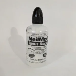 A NeilMed Sinus Rinse bottle repurposed for targeted dog grooming clean-ups.