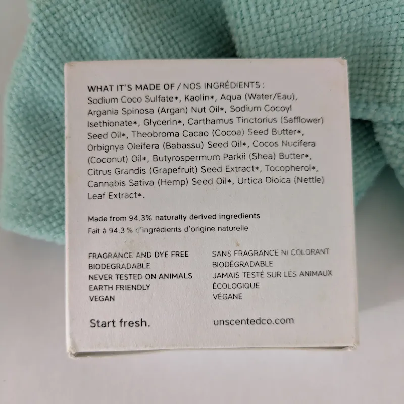 Detailed view of the natural ingredients list on the back of the shampoo bar box.